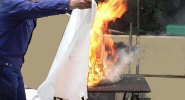 Using a fire blanket